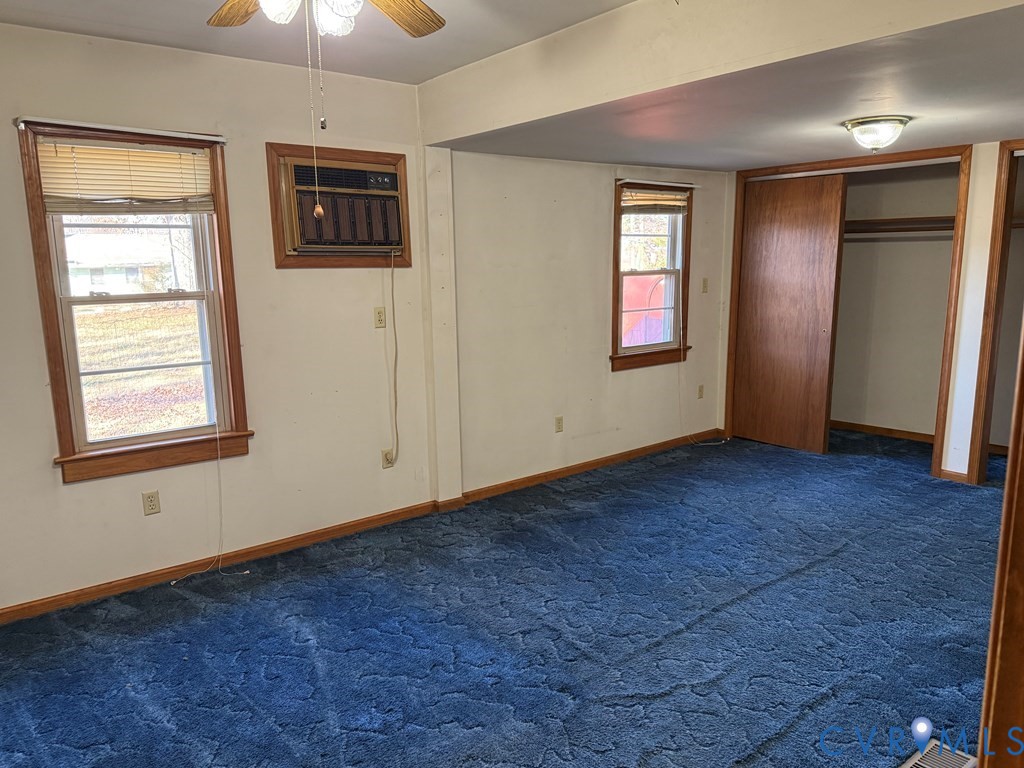 243 Tuggle Road Prospect, VA 23960 - Photo 18 of 24 an empty room with windows and cabinet