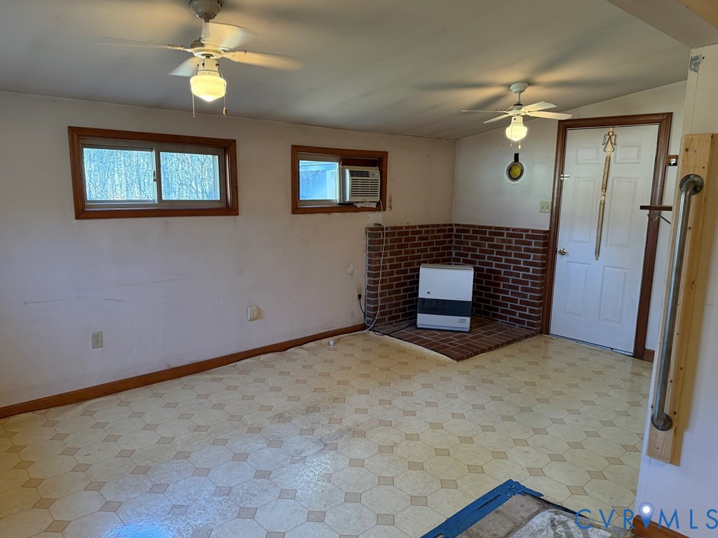 243 Tuggle Road Prospect, VA 23960 - Photo 24 of 24 en empty room with windows and ceiling fan