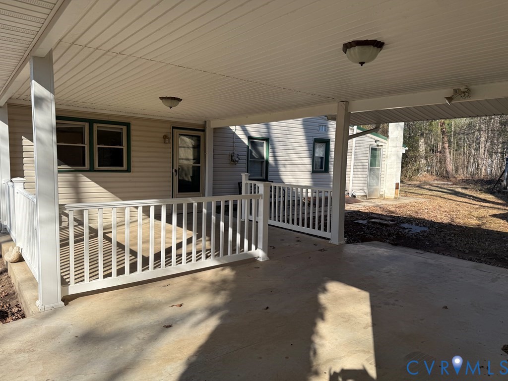 243 Tuggle Road Prospect, VA 23960 - Photo 4 of 24 a view of a porch with wooden floor and iron fence