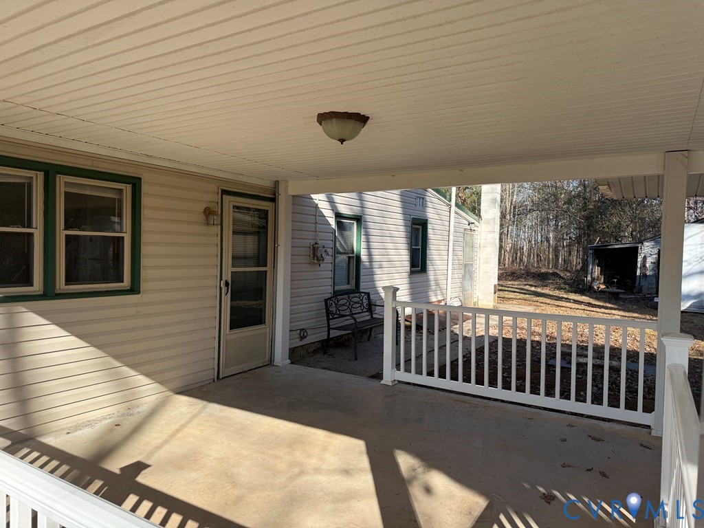 243 Tuggle Road Prospect, VA 23960 - Photo 5 of 24 a view of a house with porch and wooden floor