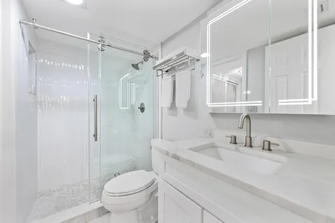 a view of a storage and utility room with washer and dryer