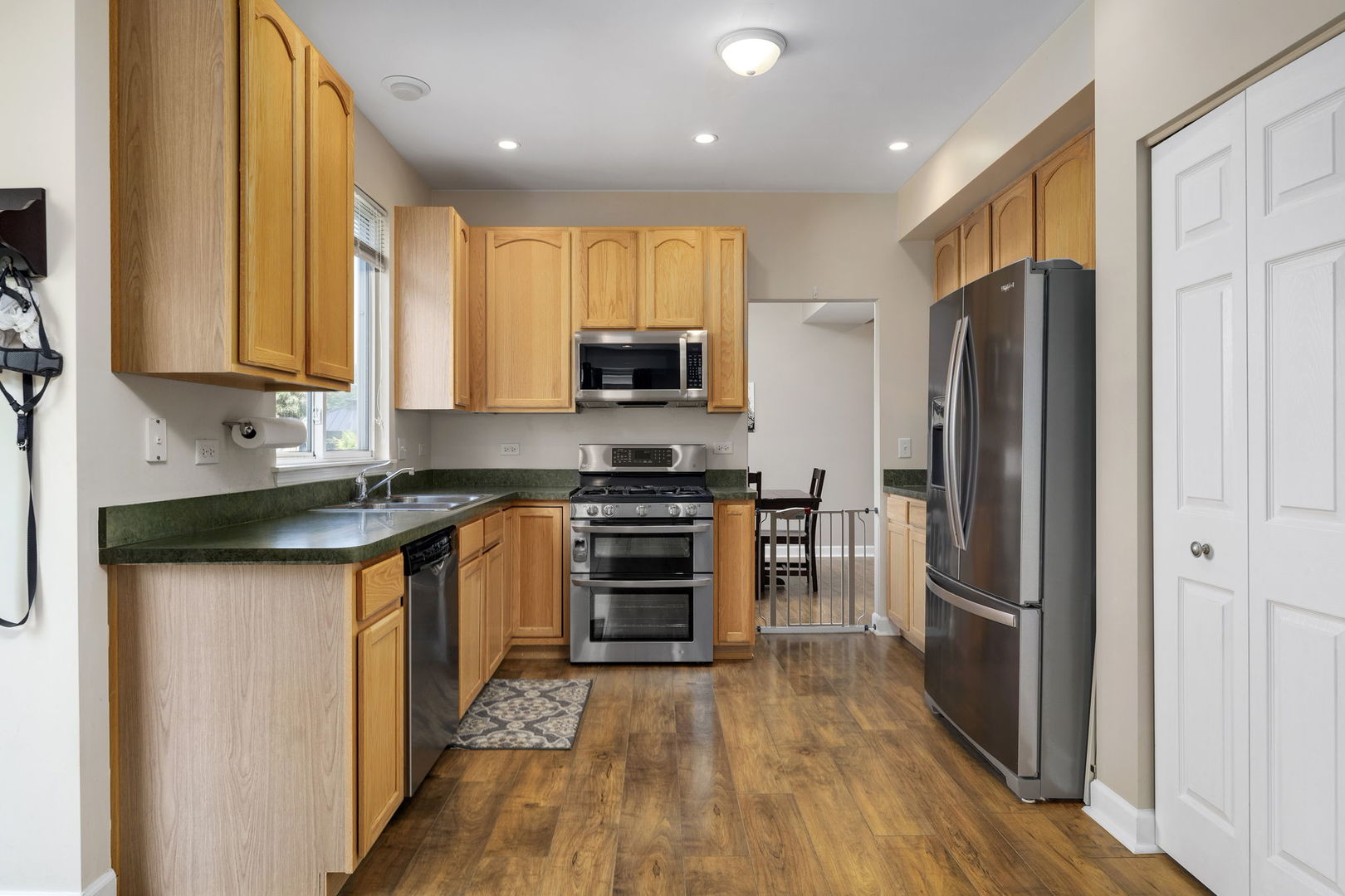 3815 Cherry Tree Lane Joliet, IL 60435 - Photo 14 of 37 a kitchen with stainless steel appliances a refrigerator and a stove top oven