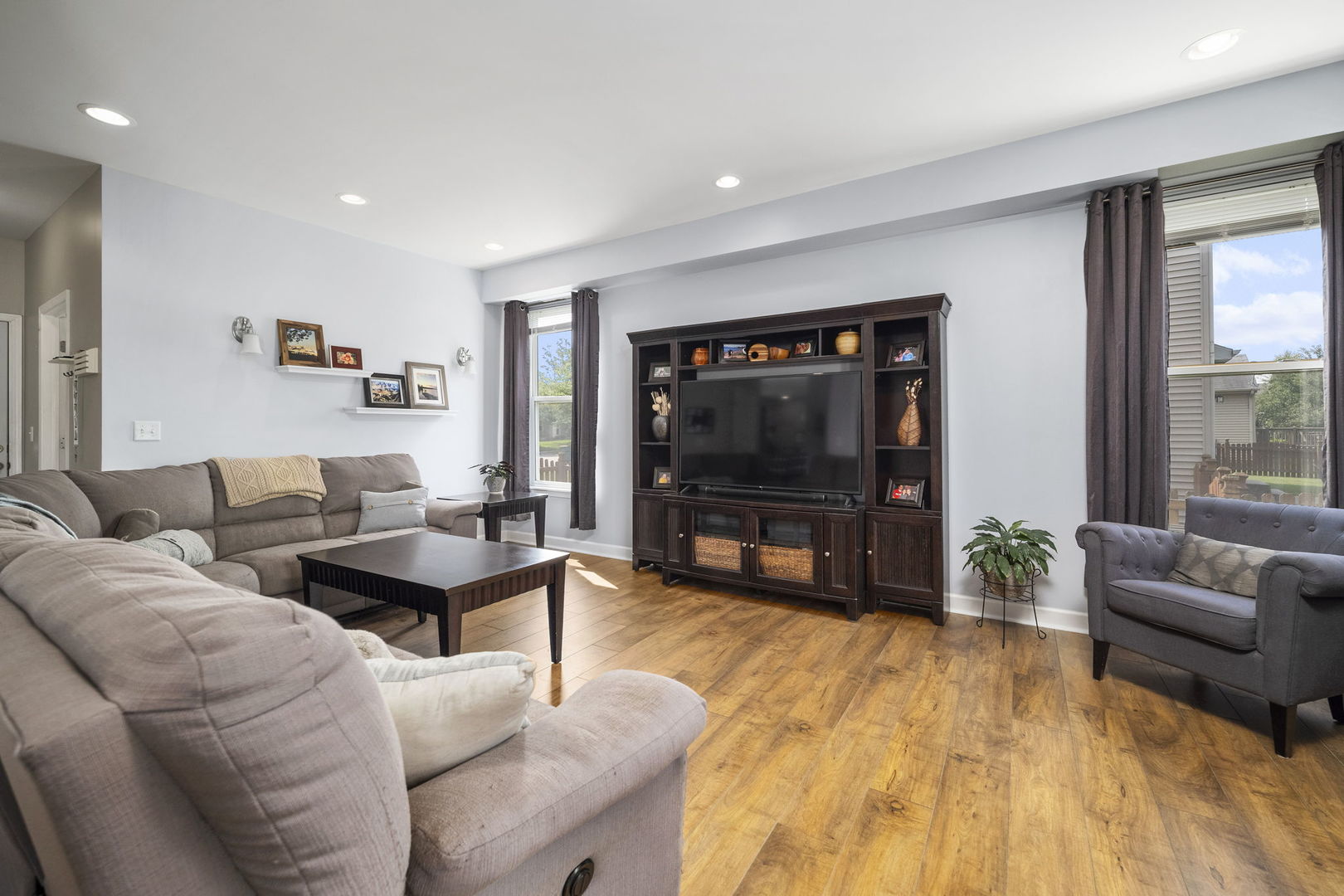3815 Cherry Tree Lane Joliet, IL 60435 - Photo 16 of 37 a living room with furniture and a flat screen tv