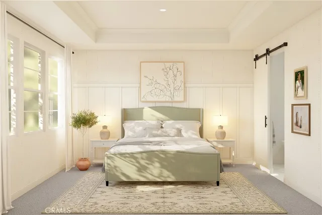 a spacious bedroom with a bed and a large window