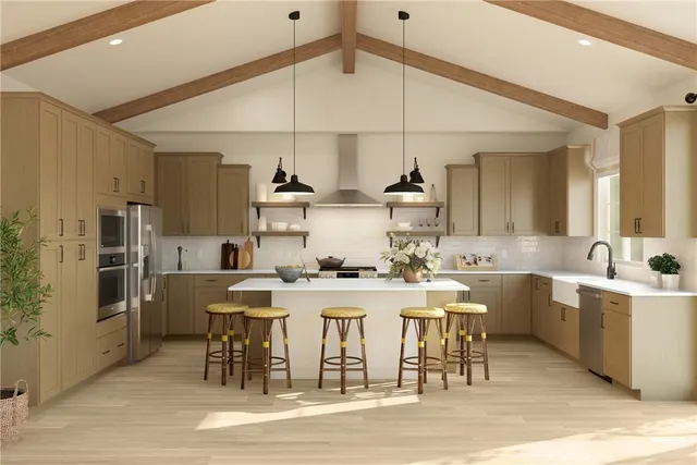 a kitchen with a sink a stove cabinets and stainless steel appliances
