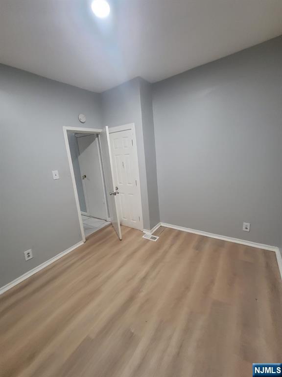 2 Montrose Terrace, Unit 1M Irvington, NJ 07111 - Photo 11 of 13 a view of an empty room and wooden floor