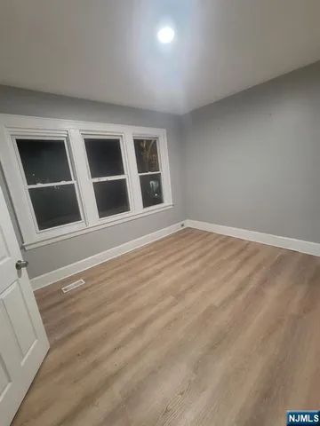 a large kitchen with a stove and a refrigerator