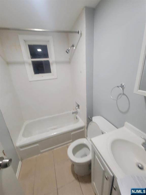 2 Montrose Terrace, Unit 1M Irvington, NJ 07111 - Photo 6 of 13 a bathroom with a sink a toilet and bathtub