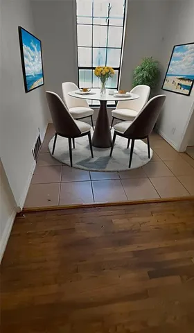 a view of a dining room with furniture and window