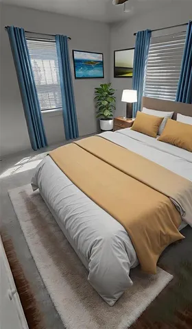 a large bed sitting in a bedroom next to a window