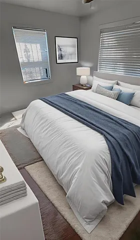 a bedroom with a bed and window