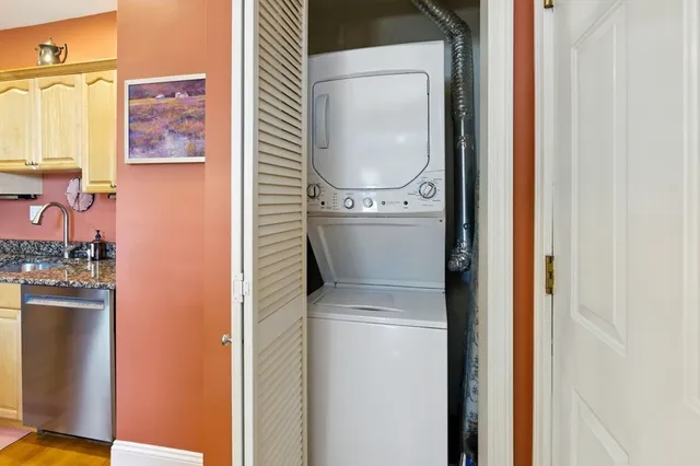 a close view of a utility room with washer and dryer