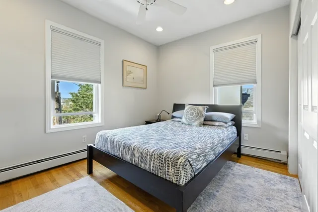 a bedroom with a bed and window