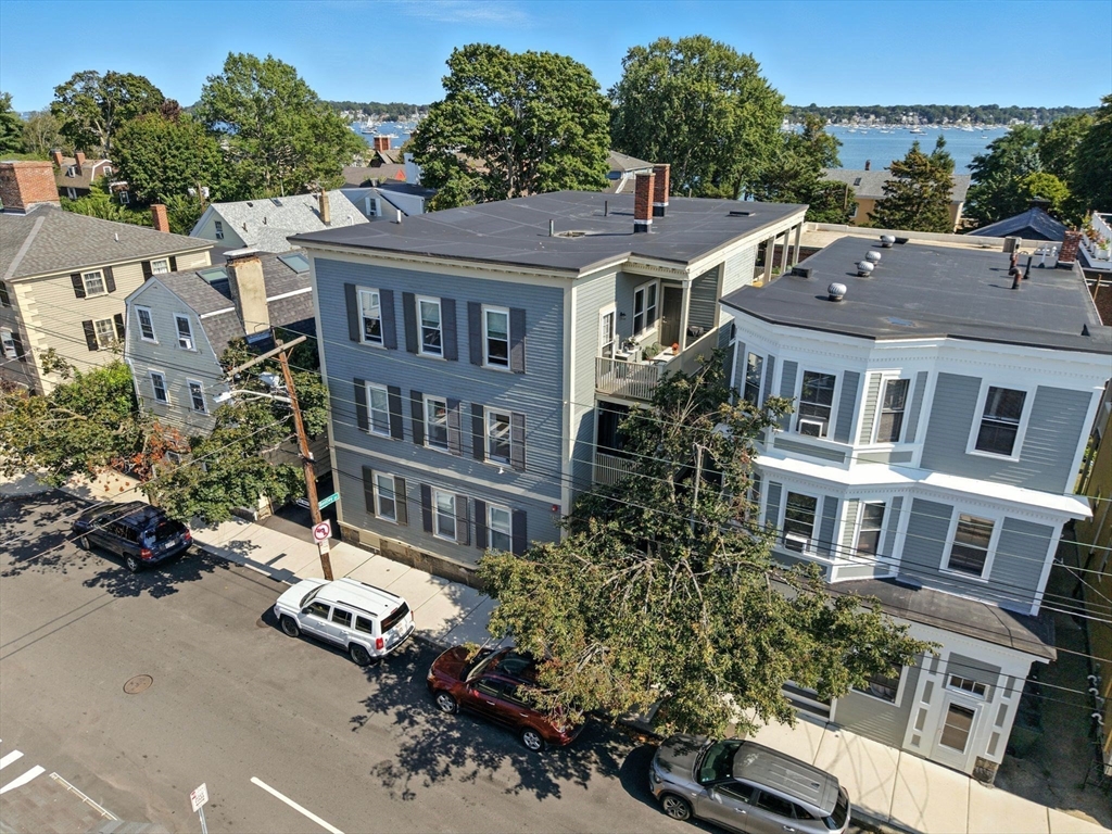 131 Derby Street, Unit 3F Salem, MA 01970 - Photo 33 of 37 a aerial view of a brick house next to a yard