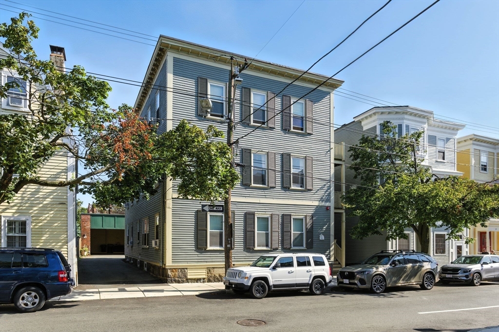 131 Derby Street, Unit 3F Salem, MA 01970 - Photo 4 of 37 a car parked in front of a building