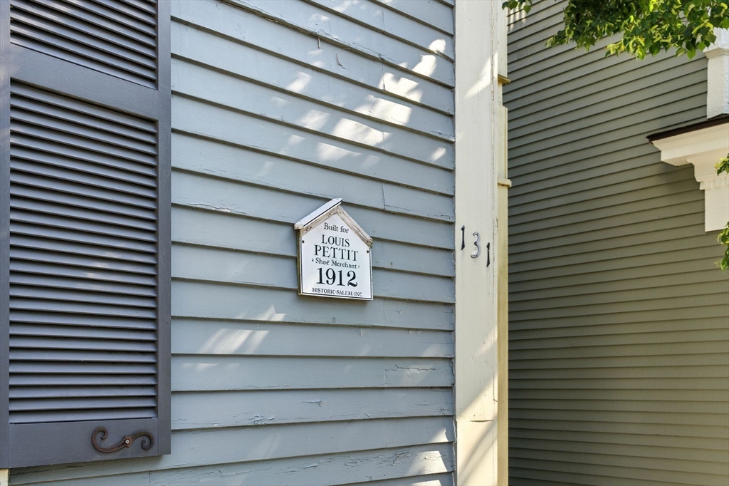 131 Derby Street, Unit 3F Salem, MA 01970 - Photo 6 of 37 a view of a street with door and a wooden roof