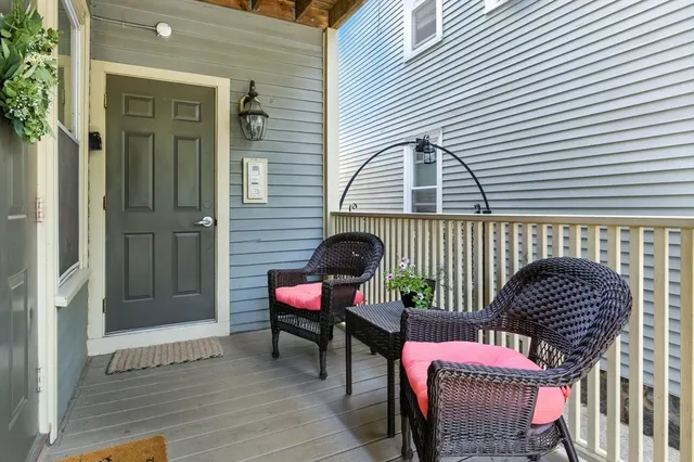 a view of a chairs and table in the balcony