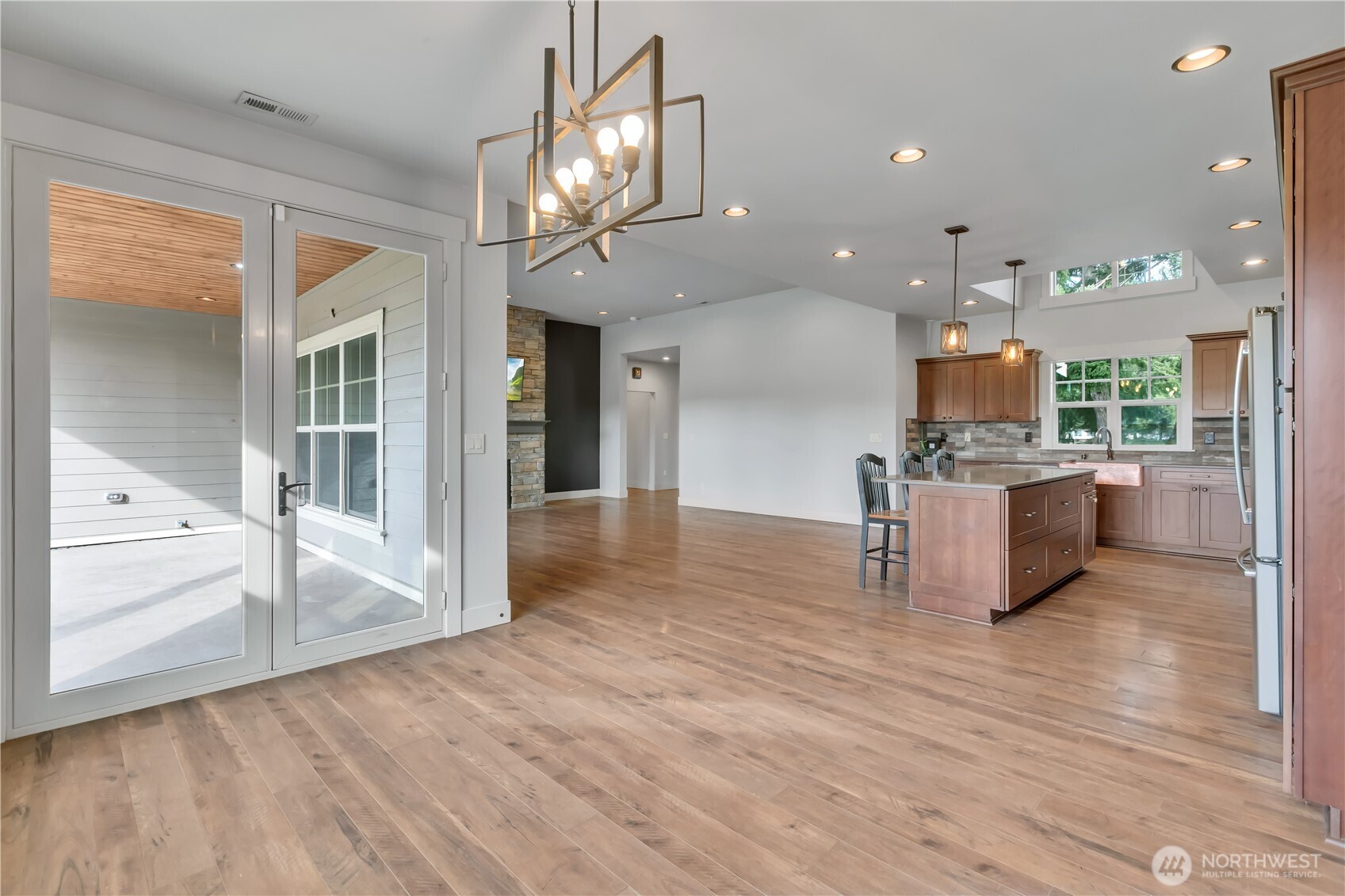 8106 Spurgeon Creek Road Southeast Olympia, WA 98513 - Photo 12 of 29 a view of kitchen with cabinets and wooden floor