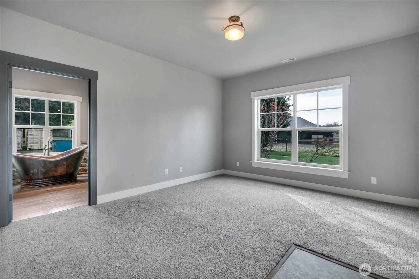 8106 Spurgeon Creek Road Southeast Olympia, WA 98513 - Photo 13 of 29 an empty room with windows and fan