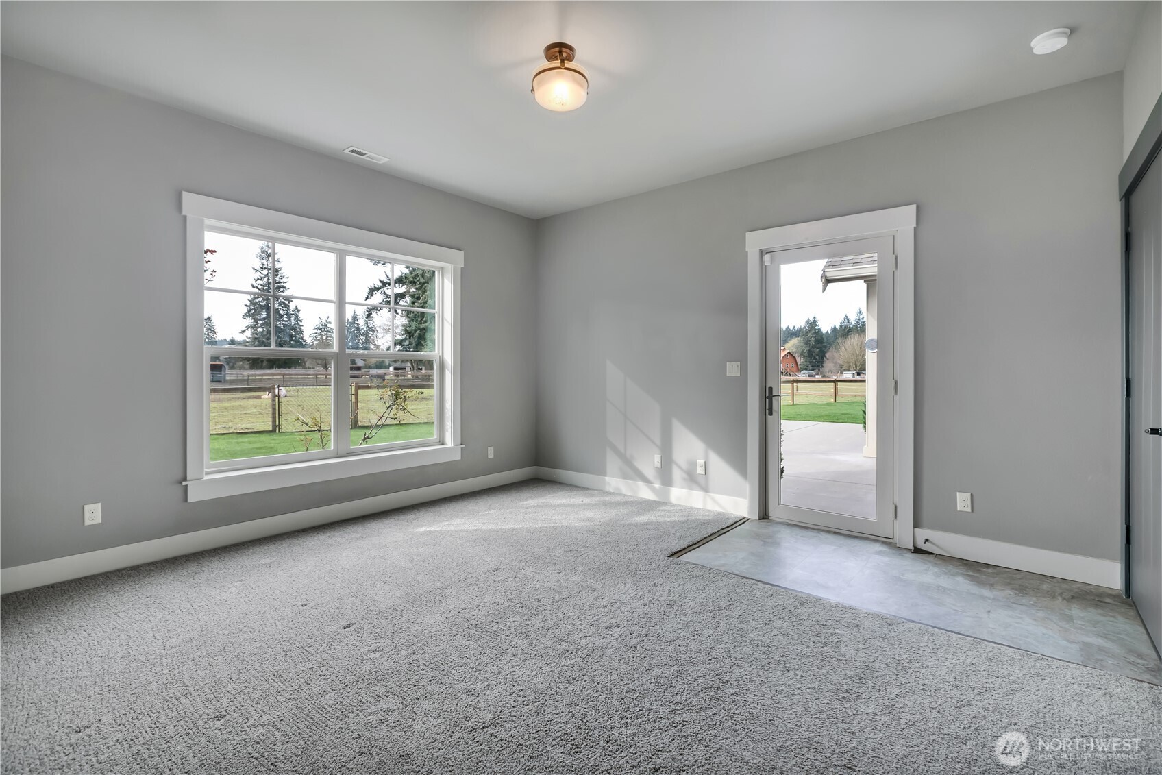 8106 Spurgeon Creek Road Southeast Olympia, WA 98513 - Photo 14 of 29 an empty room with windows and entrance
