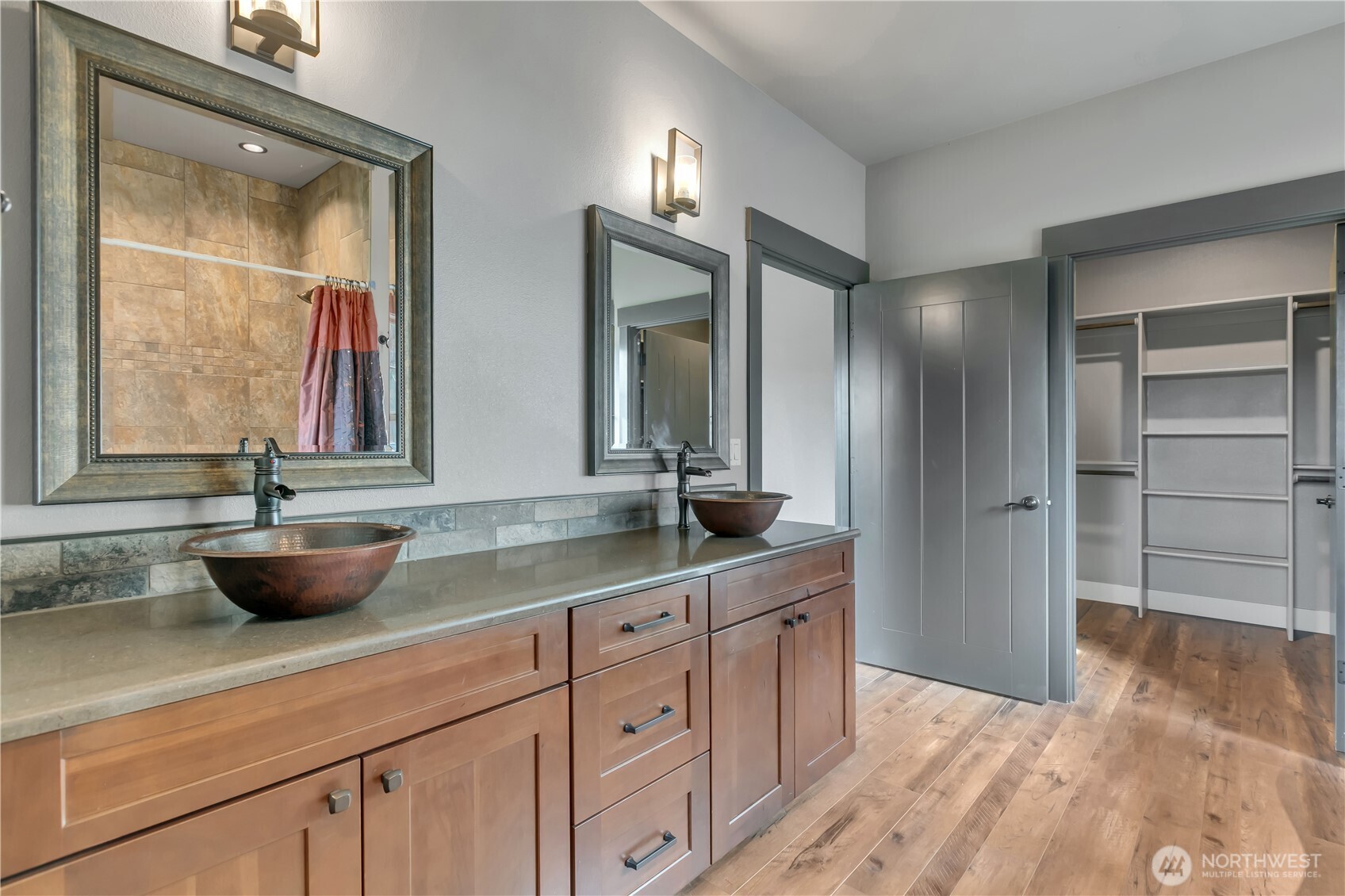 8106 Spurgeon Creek Road Southeast Olympia, WA 98513 - Photo 16 of 29 a bathroom with a double vanity sink and a mirror