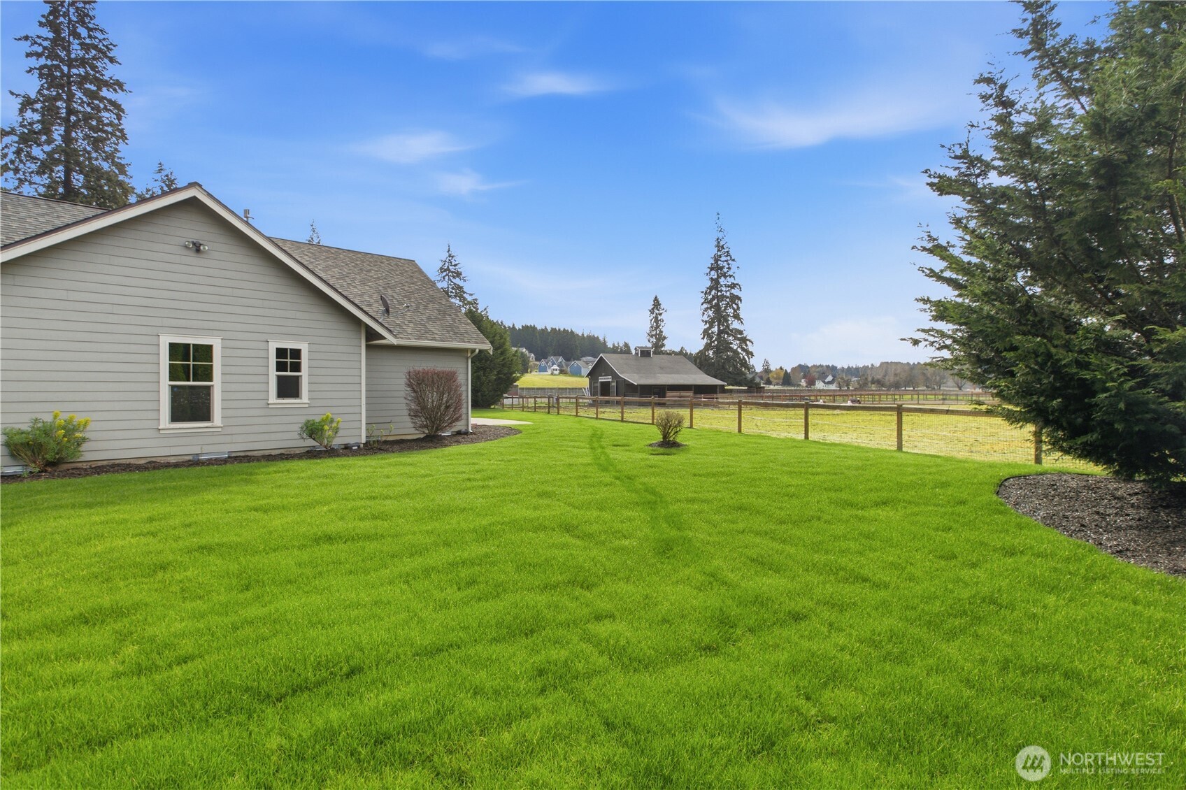 8106 Spurgeon Creek Road Southeast Olympia, WA 98513 - Photo 21 of 29 a view of a house with a yard and sitting area