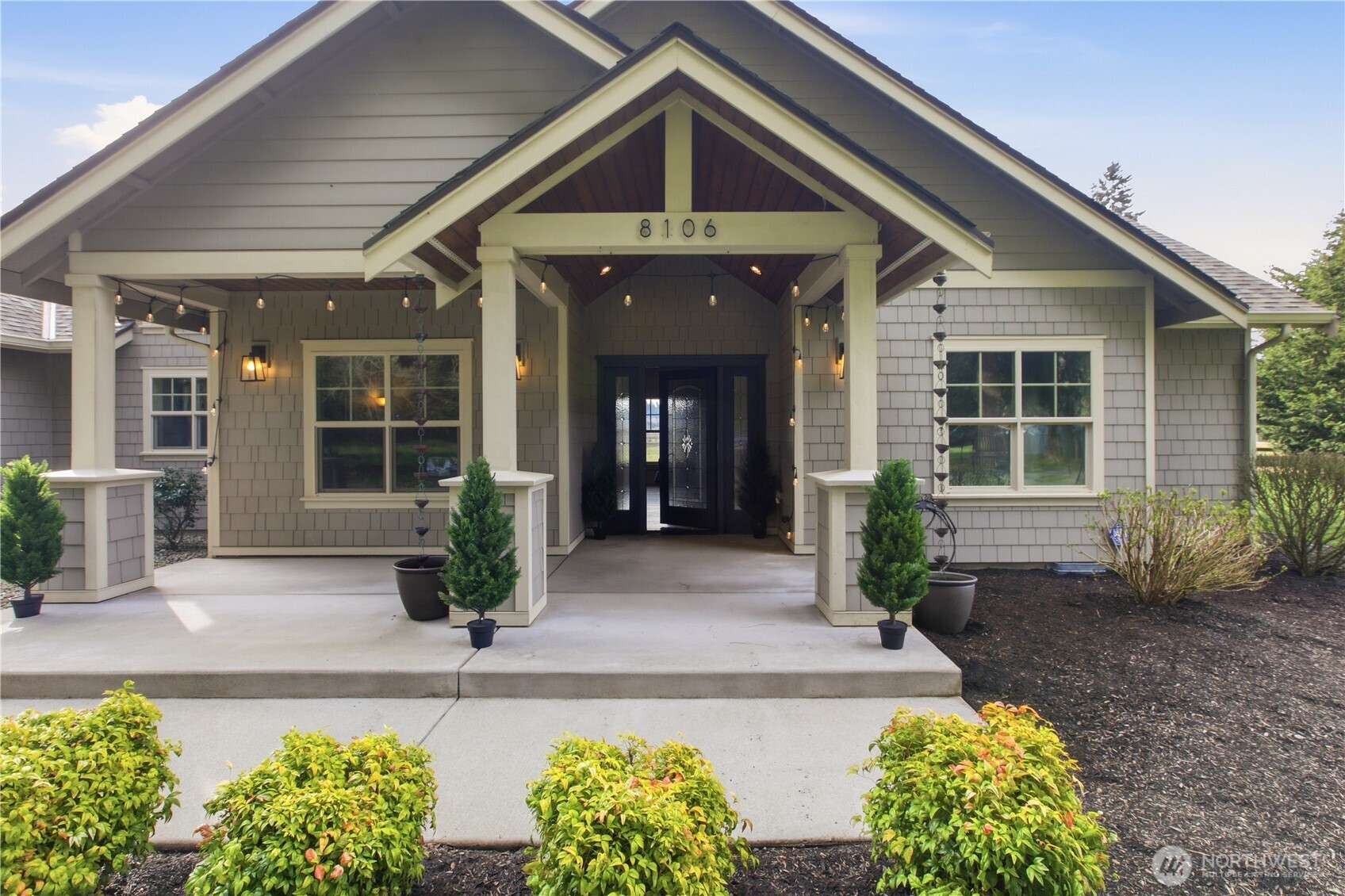 8106 Spurgeon Creek Road Southeast Olympia, WA 98513 - Photo 4 of 29 a front view of a house with garden