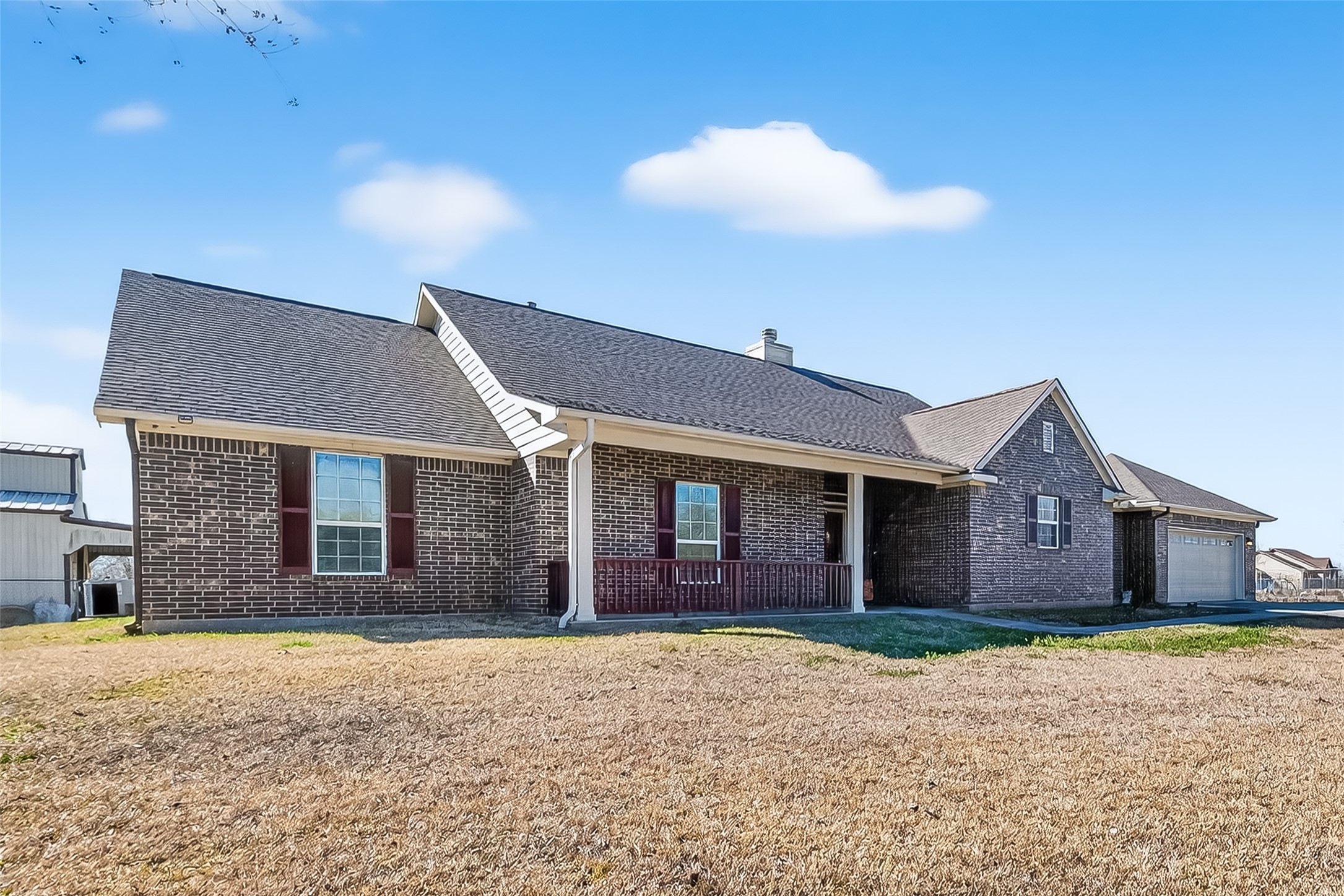 3418 Barbers Hill Road Highlands, TX 77562 - Photo 5 of 50 a front view of a house with a yard and garage
