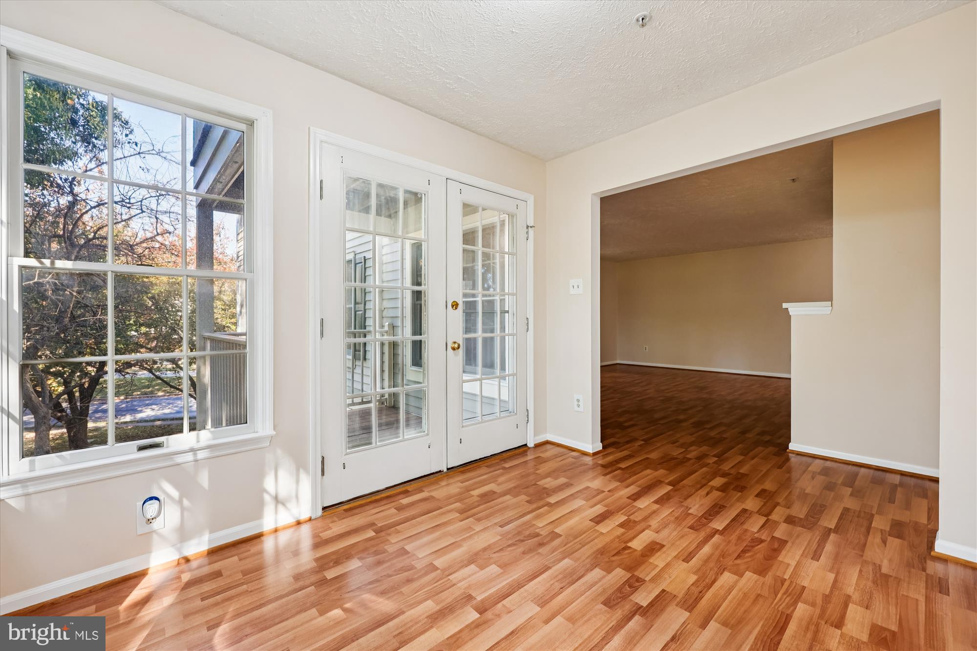 13114 Briarcliff Terrace, Unit 407 Germantown, MD 20874 - Photo 15 of 77 a bedroom with a bed and wooden floor
