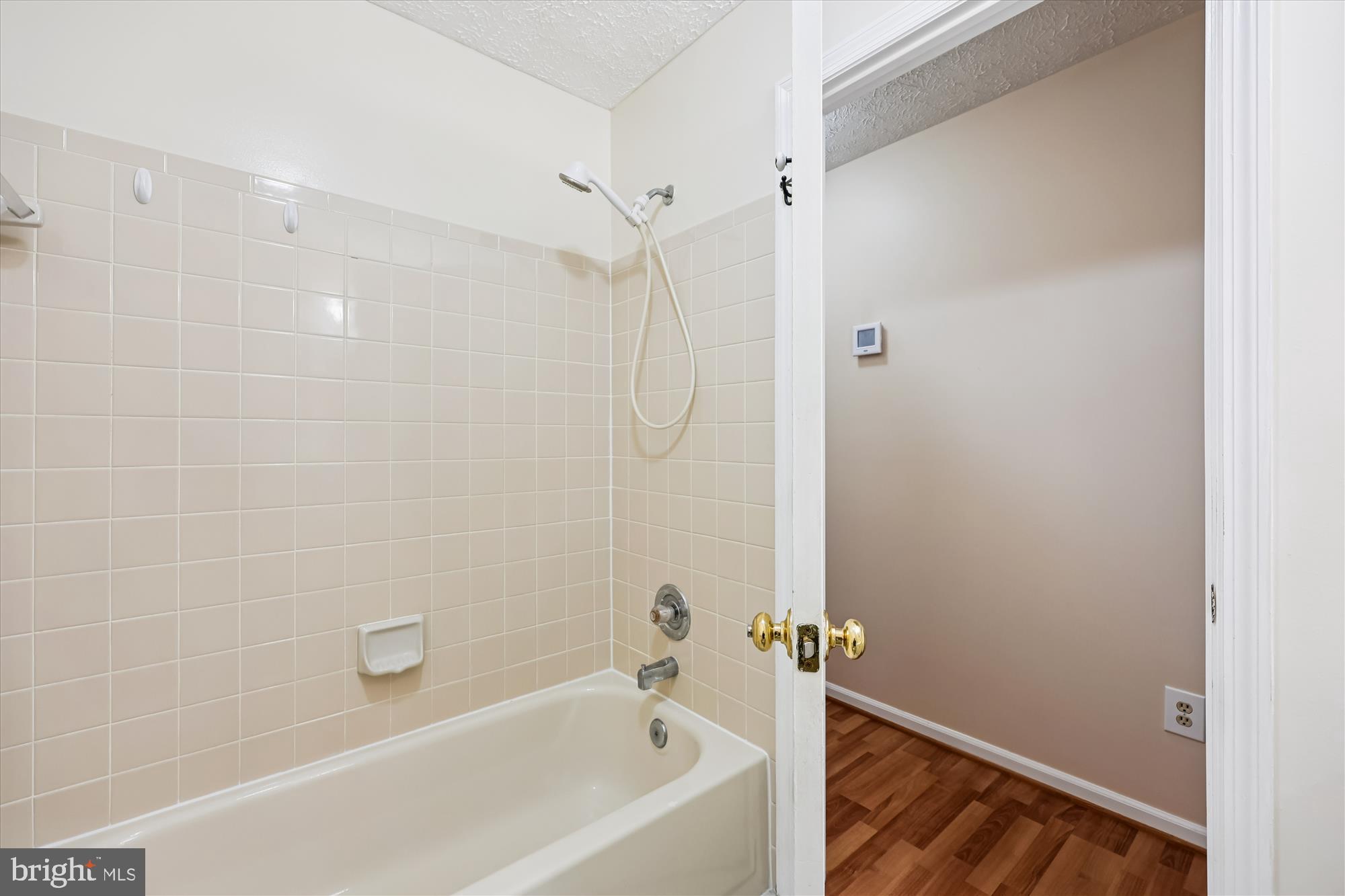13114 Briarcliff Terrace, Unit 407 Germantown, MD 20874 - Photo 32 of 77 a bathroom with a bathtub and shower