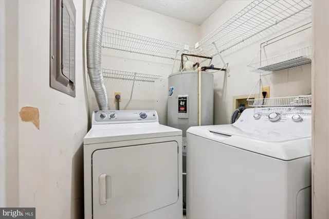 a front view of a house with yard and trees