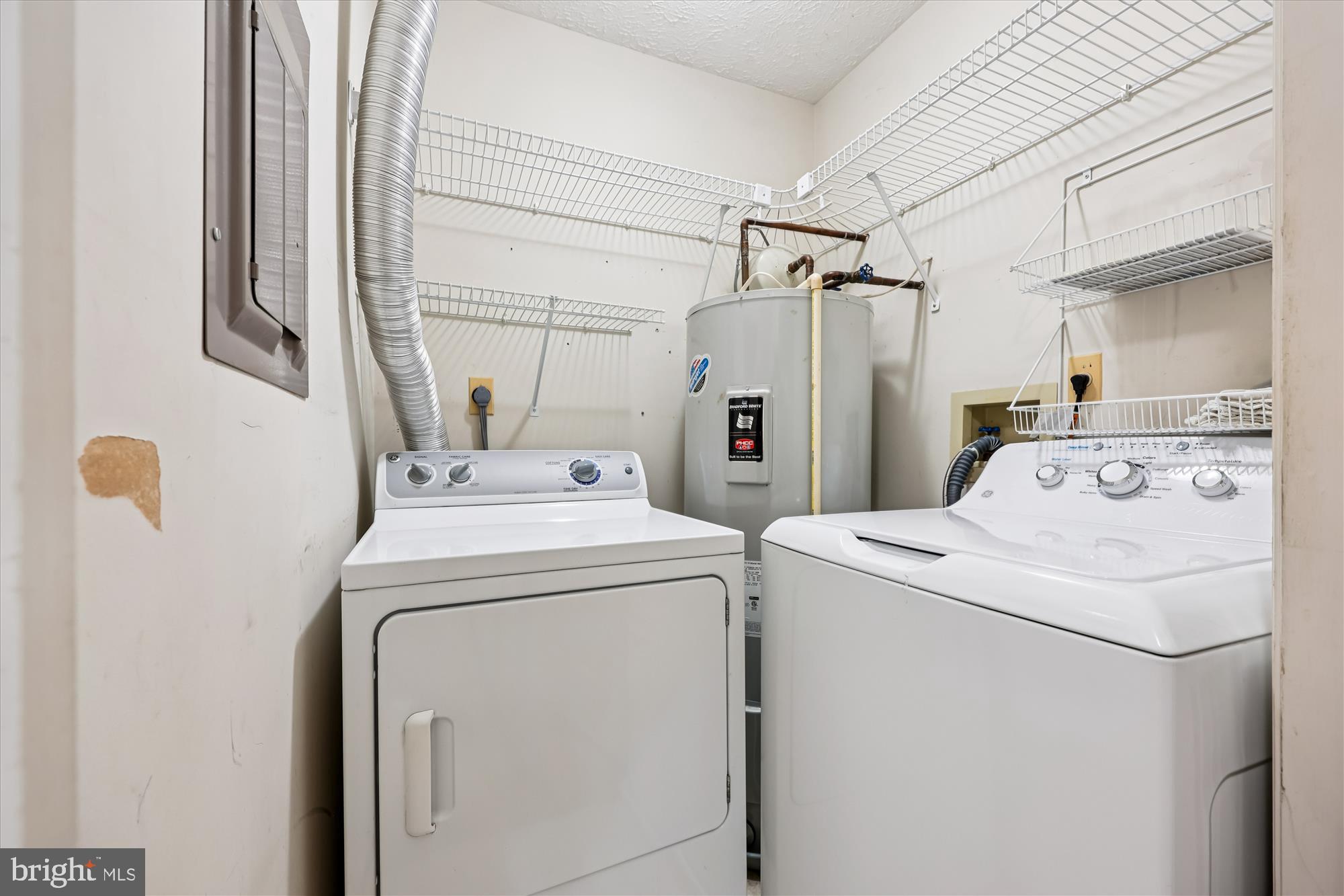13114 Briarcliff Terrace, Unit 407 Germantown, MD 20874 - Photo 33 of 77 a utility room with dryer and washer