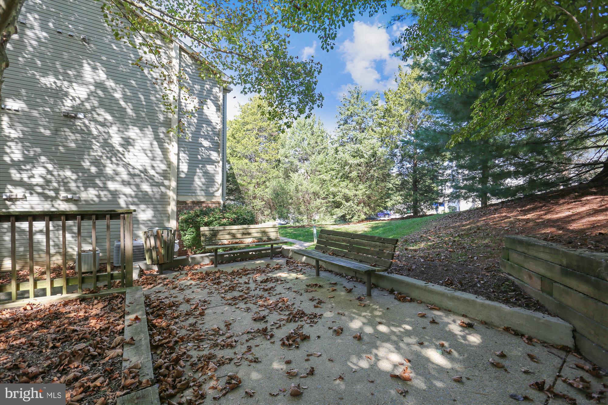 13114 Briarcliff Terrace, Unit 407 Germantown, MD 20874 - Photo 41 of 77 a backyard of a house with outdoor seating