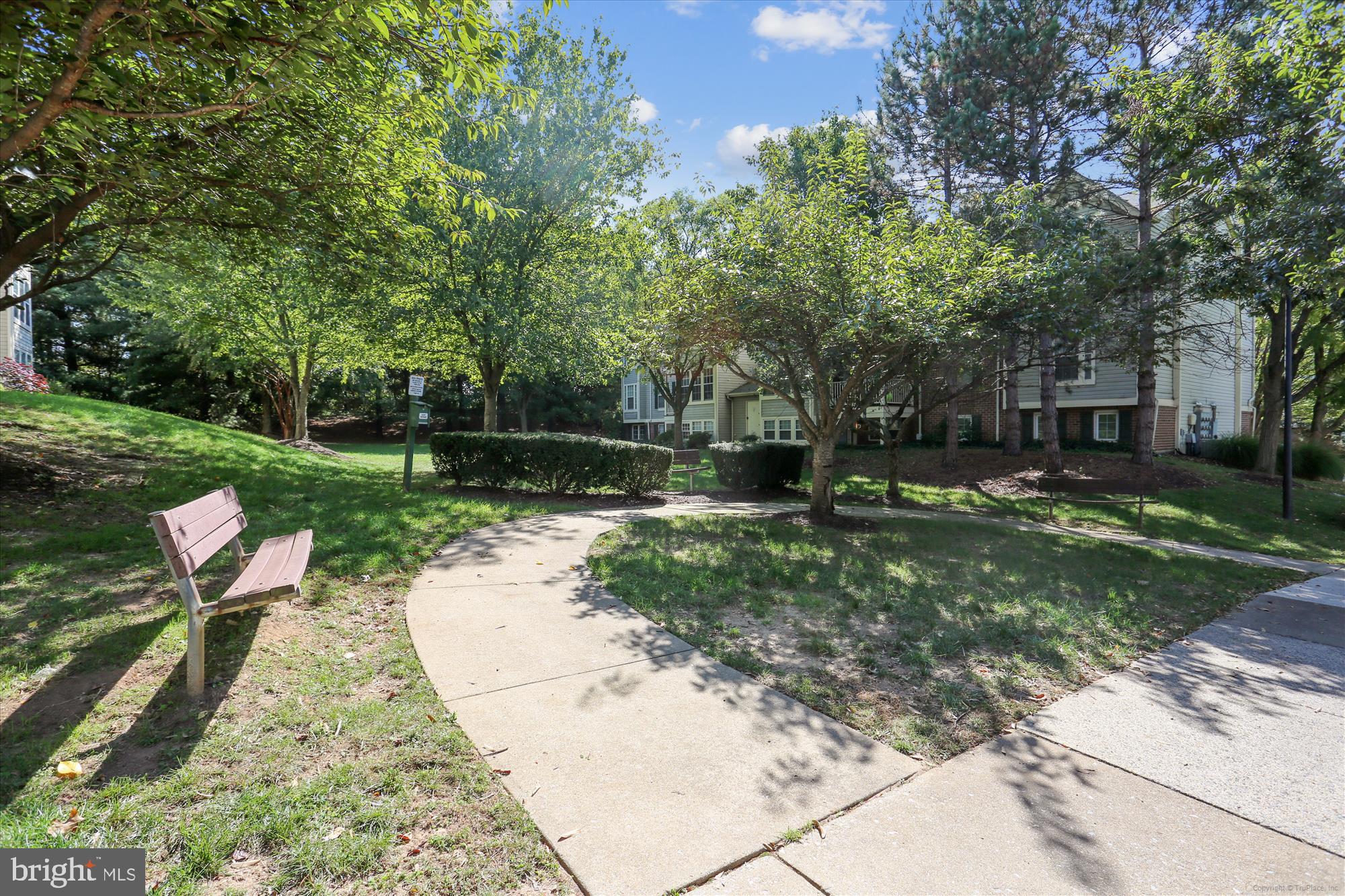13114 Briarcliff Terrace, Unit 407 Germantown, MD 20874 - Photo 44 of 77 a backyard of a house with fountain table and chairs
