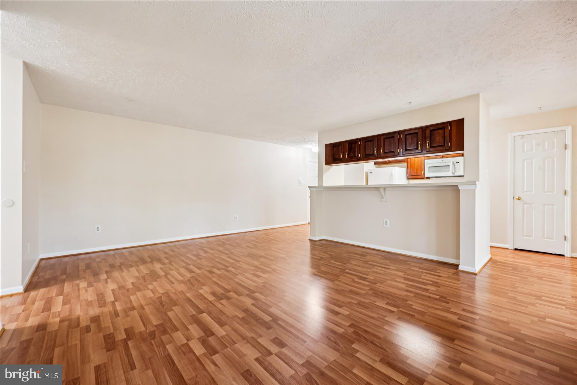 13114 Briarcliff Terrace, Unit 407 Germantown, MD 20874 - Photo 6 of 77 a view of empty room with wooden floor