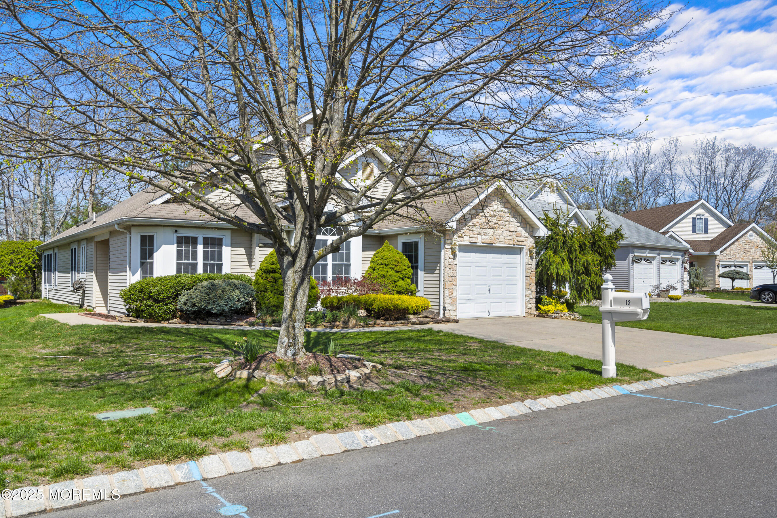 12 Rye Court Jackson, NJ 08527 - Photo 2 of 38 a front view of house with yard and green space