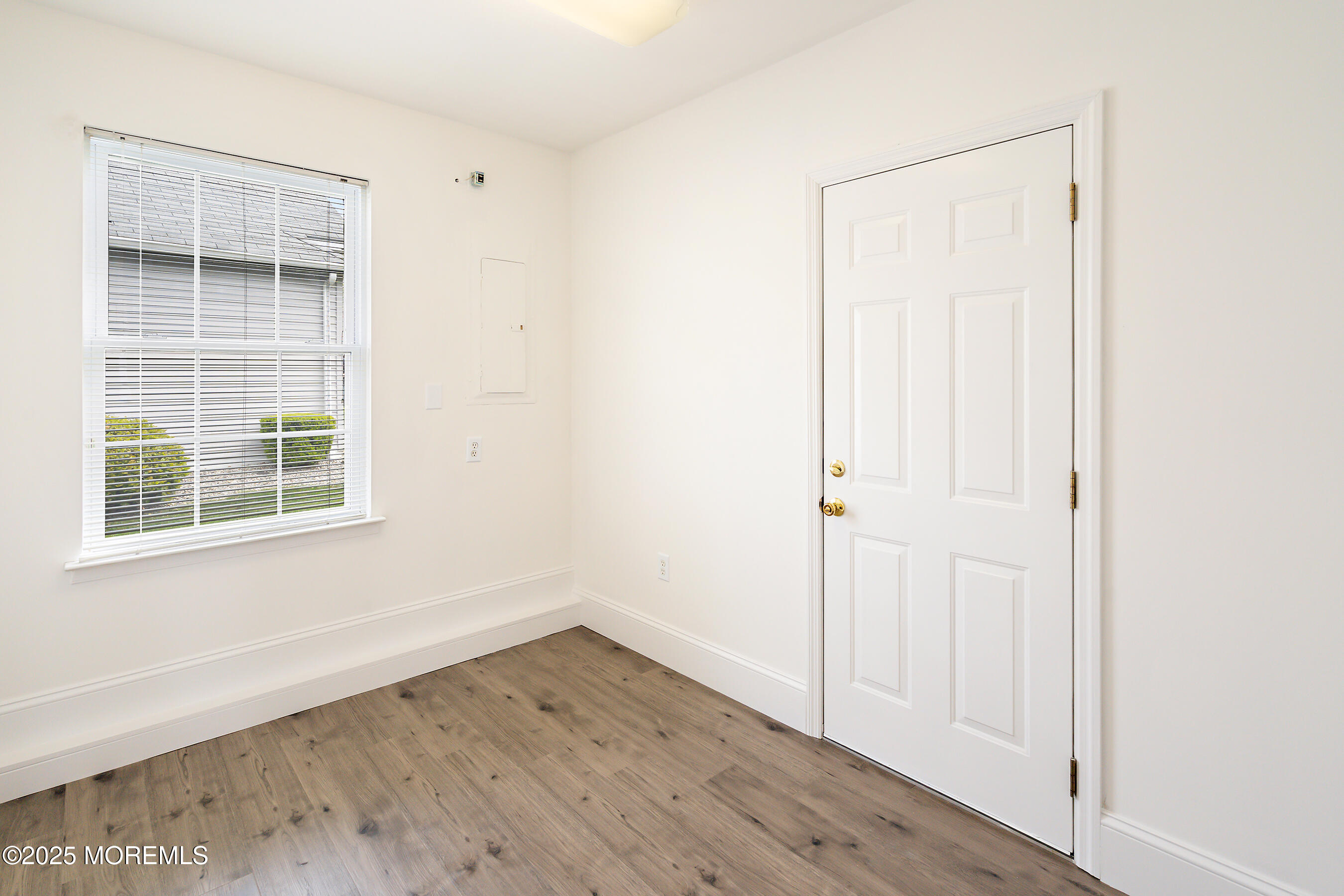 12 Rye Court Jackson, NJ 08527 - Photo 24 of 38 an empty room with wooden floor and windows