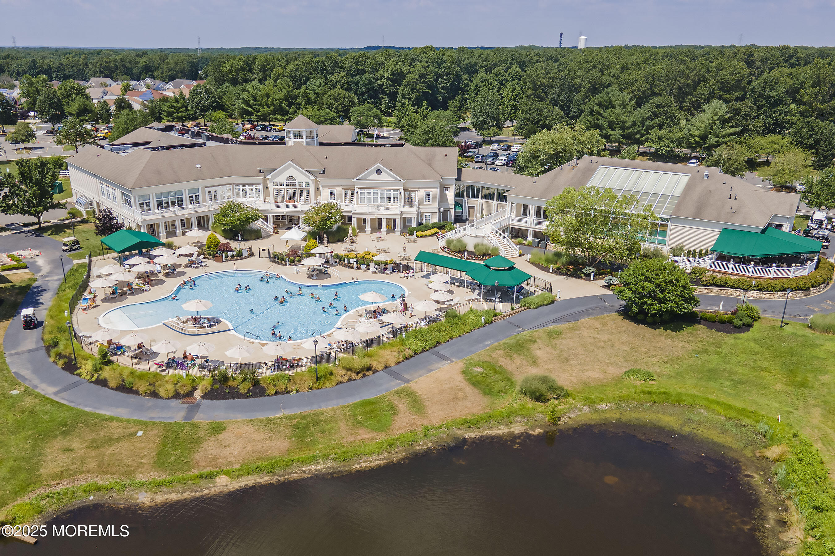 12 Rye Court Jackson, NJ 08527 - Photo 32 of 38 a view of a swimming pool with a garden