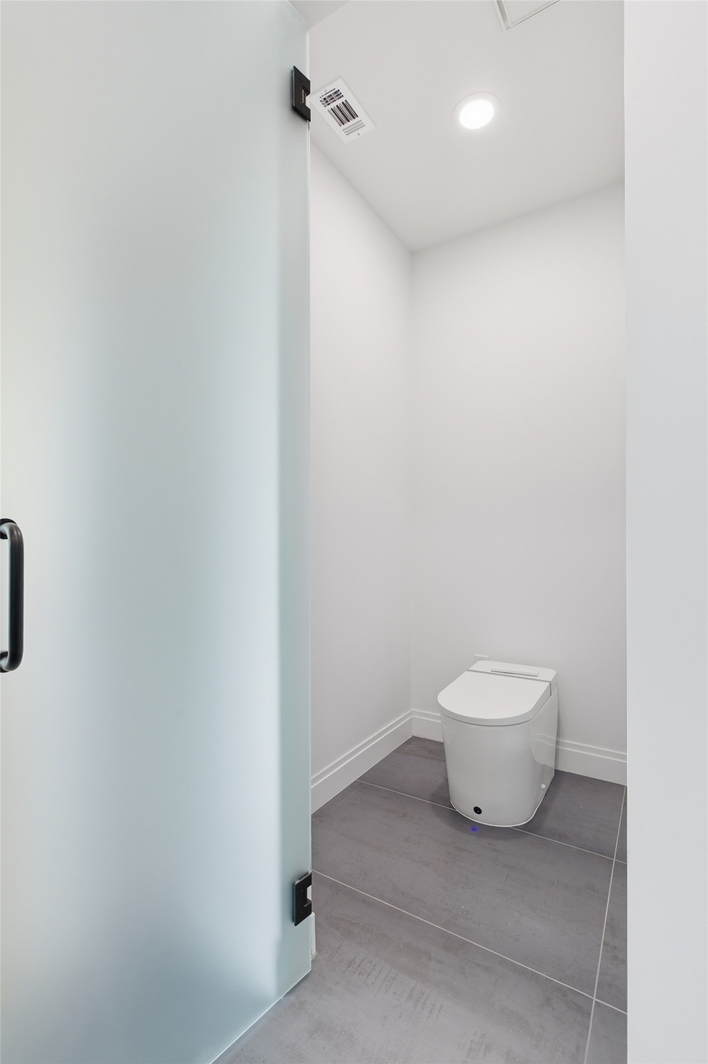 5013 Rob-Scott Street Austin, TX 78721 - Photo 20 of 35 Privacy glass to the water closet and an integrated bidet toilet.