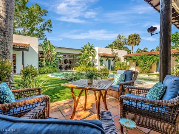 a view of an chairs and tables in the patio