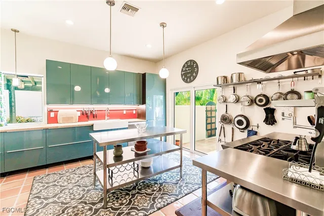 a room with pool table and windows