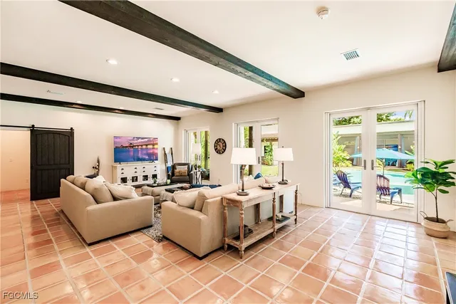 a bed room with furniture and wooden floor