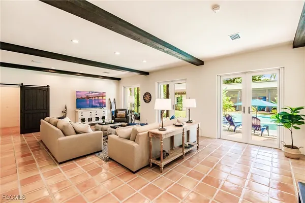 a bed room with furniture and wooden floor