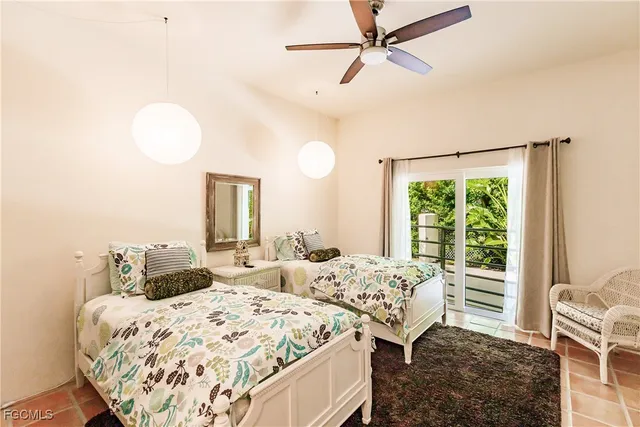 a bedroom with double bed and a window