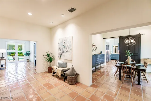 a lobby with furniture and floor to ceiling window