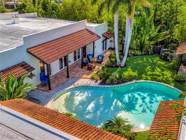 a view of a backyard with sitting area