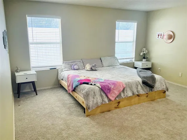 a bedroom with a bed and a table