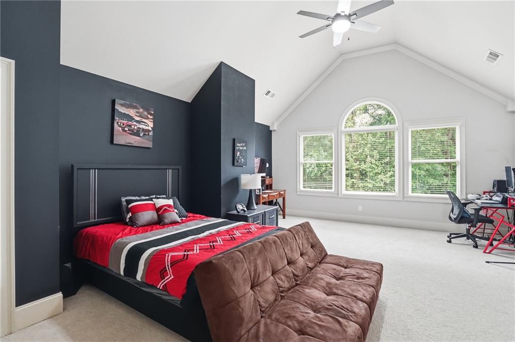 8340 Colonial Place Duluth, GA 30097 - Photo 40 of 74 a bedroom with a bed and a large window