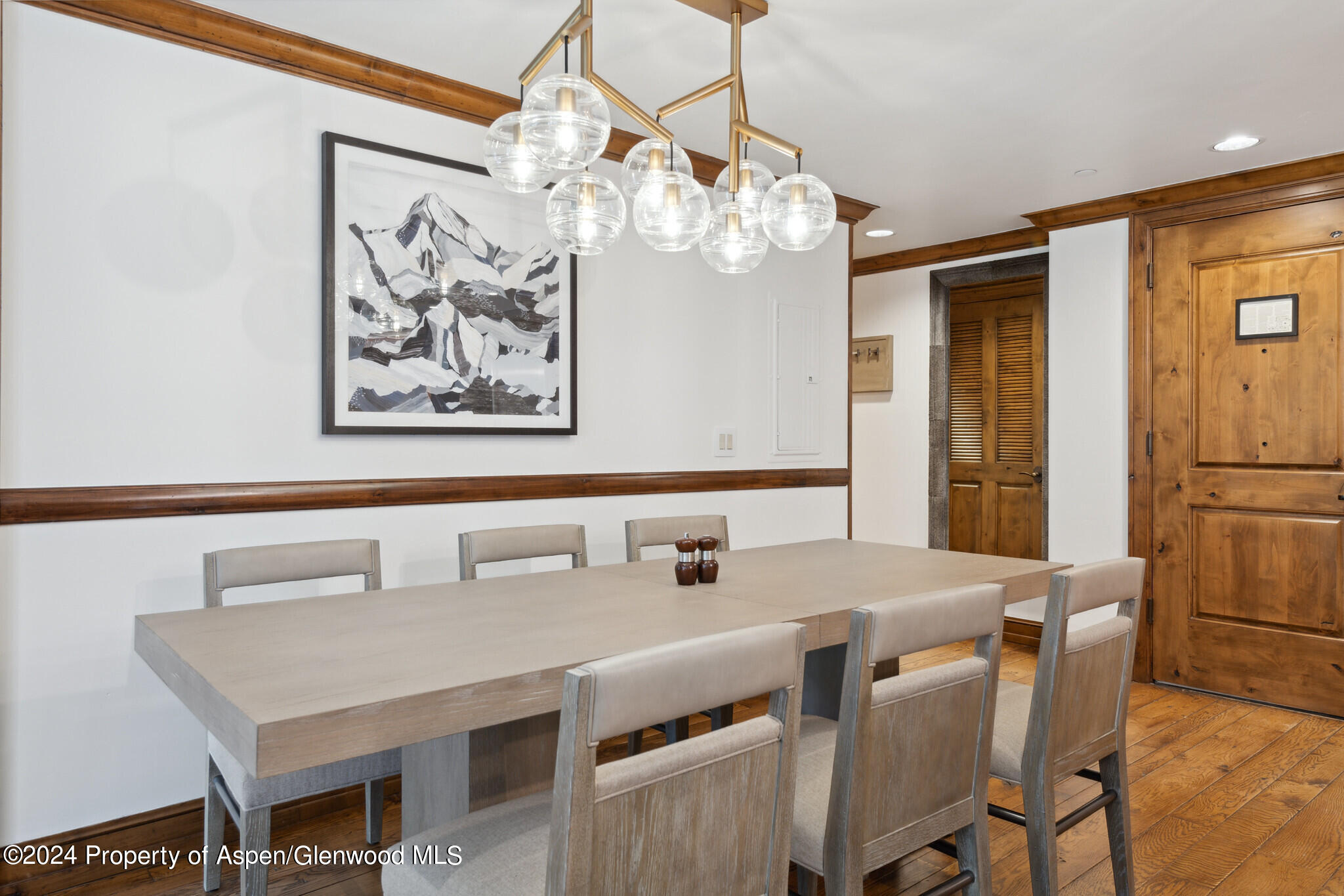 415 East Dean St Unit 22 Week 6 Aspen, CO 81611 - Photo 11 of 25 a view of a dining room with furniture and chandelier