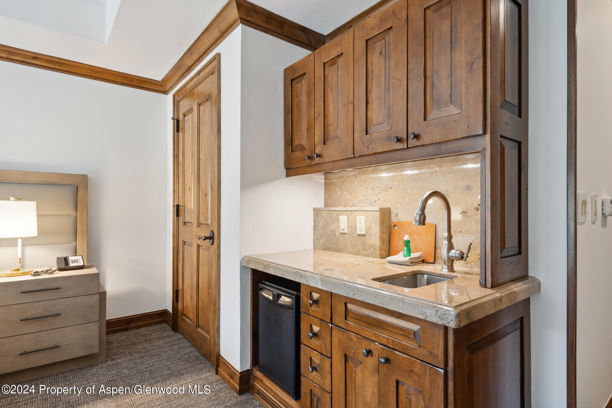 415 East Dean St Unit 22 Week 6 Aspen, CO 81611 - Photo 18 of 25 a kitchen with stainless steel appliances granite countertop a stove and a sink